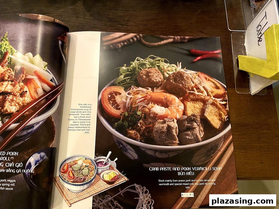 A menu page from Co Chung Vietnamese Restaurant showcasing their Crab Paste and Pork Vermicelli Soup (Bún Riêu).