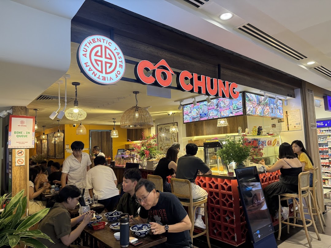 A bustling interior view of Co Chung Vietnamese Restaurant with customers enjoying their meals.