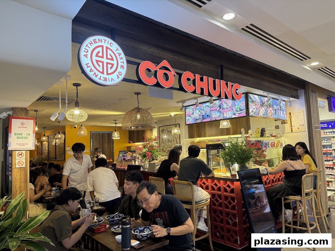 A bustling interior view of Co Chung Vietnamese Restaurant with customers enjoying their meals.