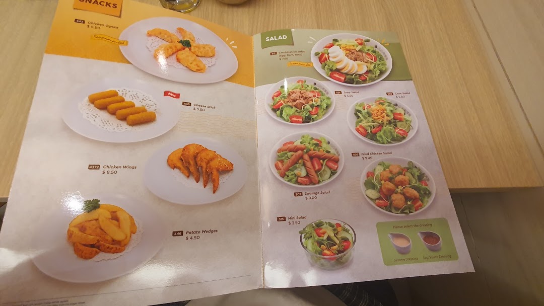 A detailed menu page displaying various snacks and salads with prices and images.