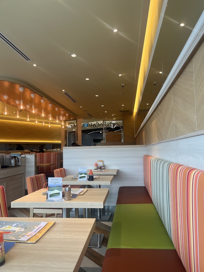 Bright and inviting interior of CoCo ICHIBANYA with comfortable seating and dining tables.