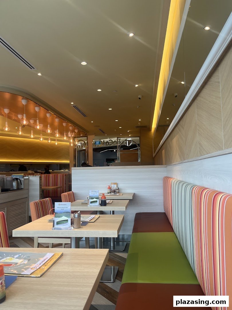 Bright and inviting interior of CoCo ICHIBANYA with comfortable seating and dining tables.