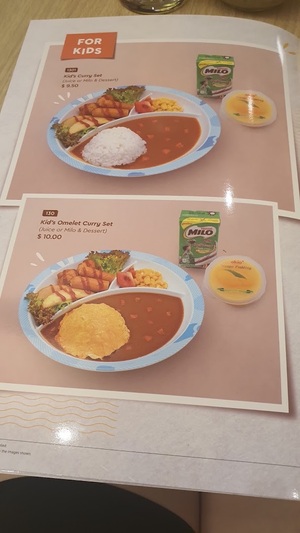 A menu page displaying two kids' curry sets with accompanying drinks and desserts.
