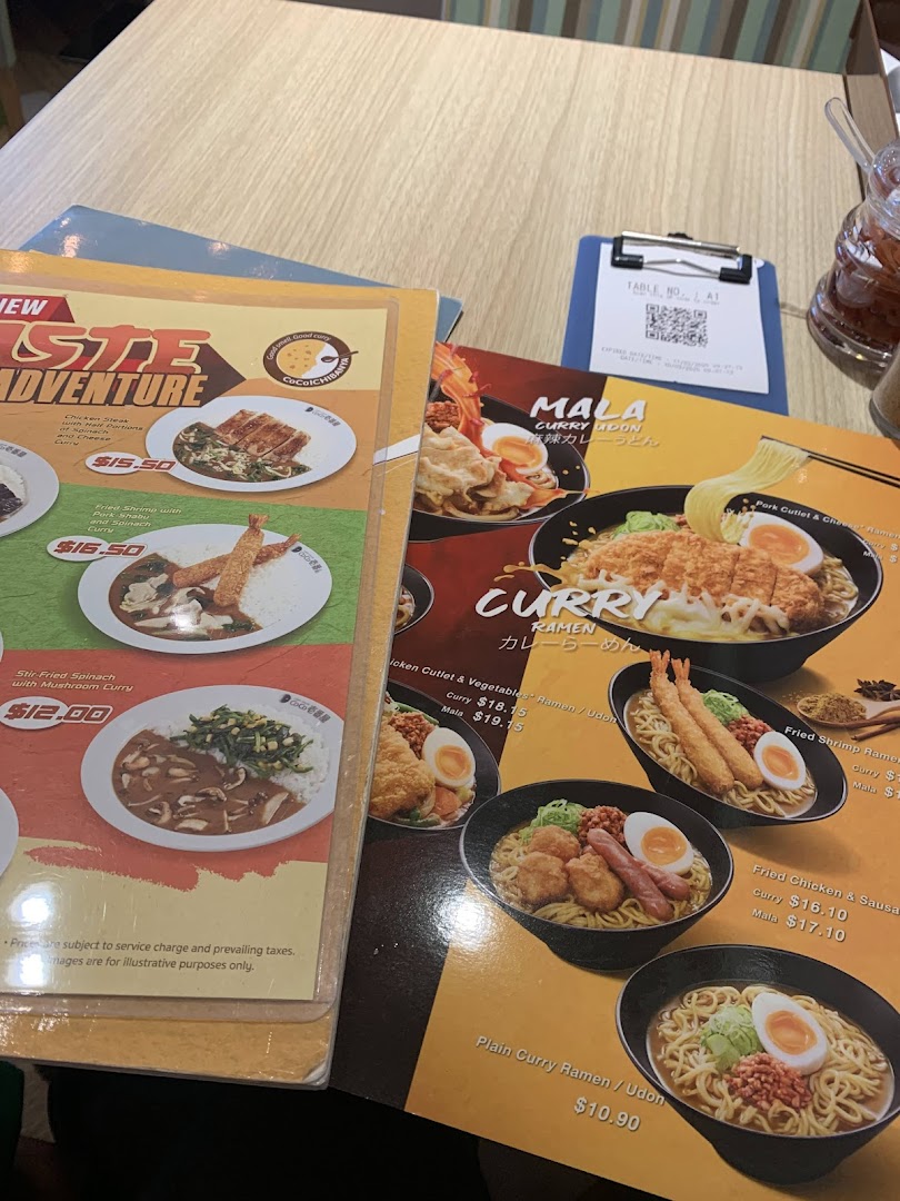 Close-up of CoCo ICHIBANYA's diverse menu featuring curry, ramen, and udon dishes.