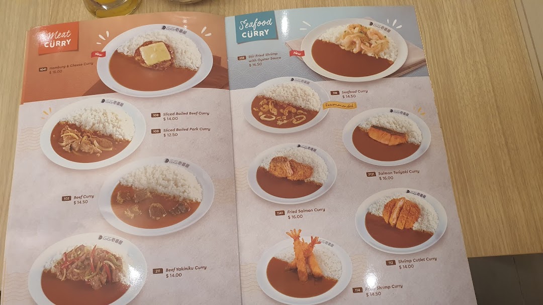 A detailed menu page from CoCo ICHIBANYA featuring various curry dishes with meat and seafood.