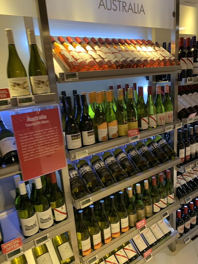 A well-stocked wine aisle featuring a wide selection of bottles, including Australian wines, at CS Fresh.