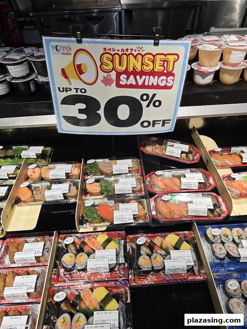 A display of pre-packaged sushi sets from YoYo Sushi with a 'Sunset Savings' promotion sign at CS Fresh.