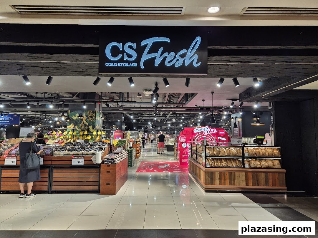 The entrance of CS Fresh supermarket, showcasing fresh produce, a bakery, and a wide array of daily essentials.