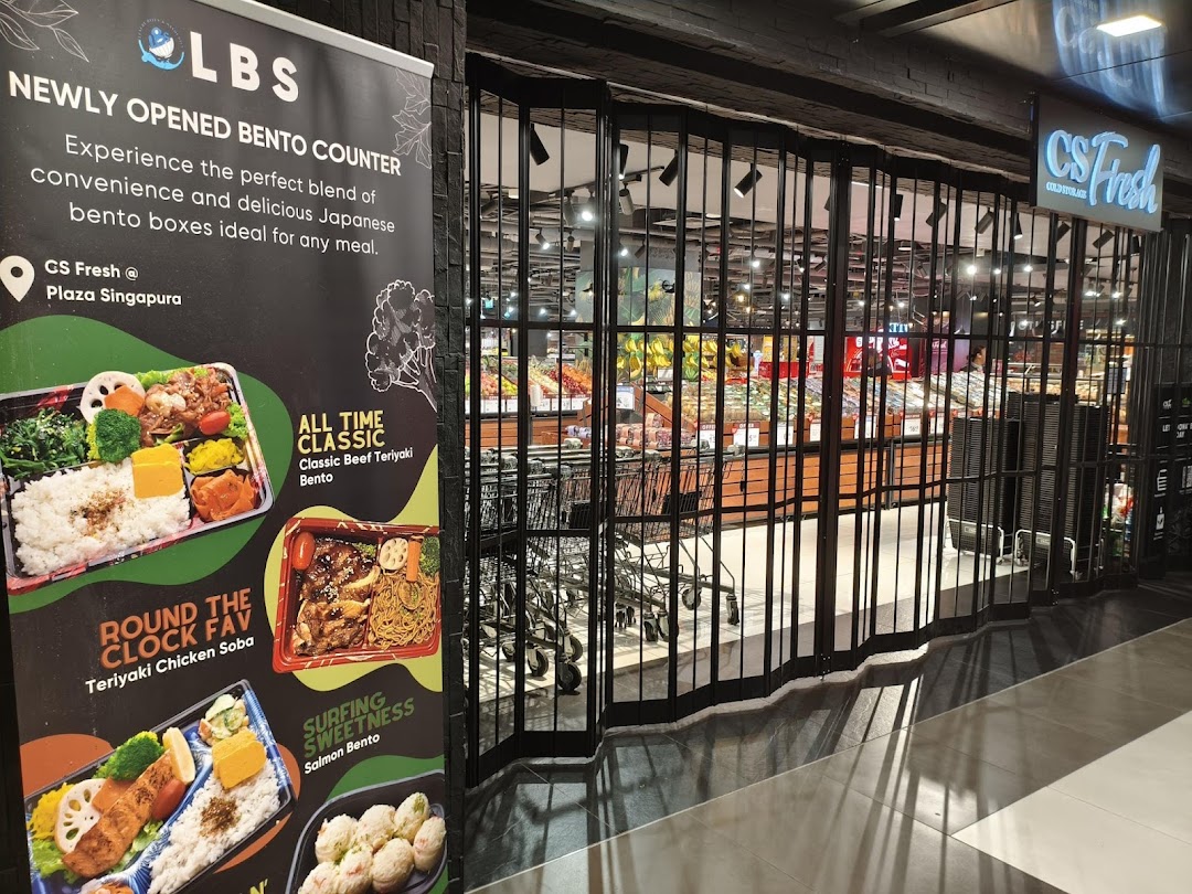 Entrance of CS Fresh supermarket with a promotional banner for their new Japanese bento counter.