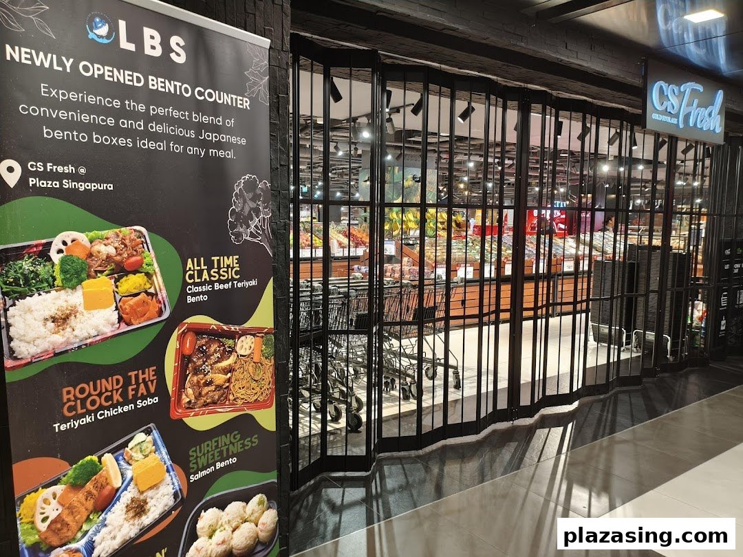 Entrance of CS Fresh supermarket with a promotional banner for their new Japanese bento counter.