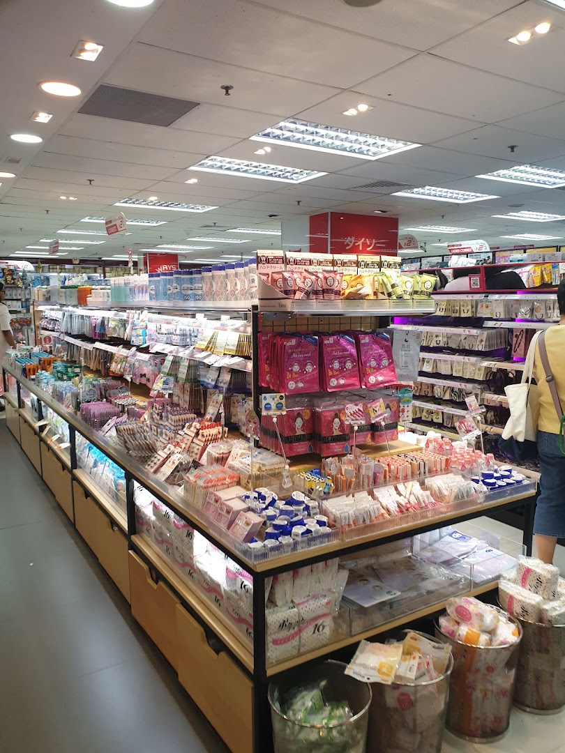 An interior view of DAISO THREEPPY, showcasing aisles filled with diverse Japanese lifestyle products and household goods.