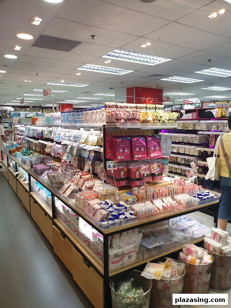 An interior view of DAISO THREEPPY, showcasing aisles filled with diverse Japanese lifestyle products and household goods.