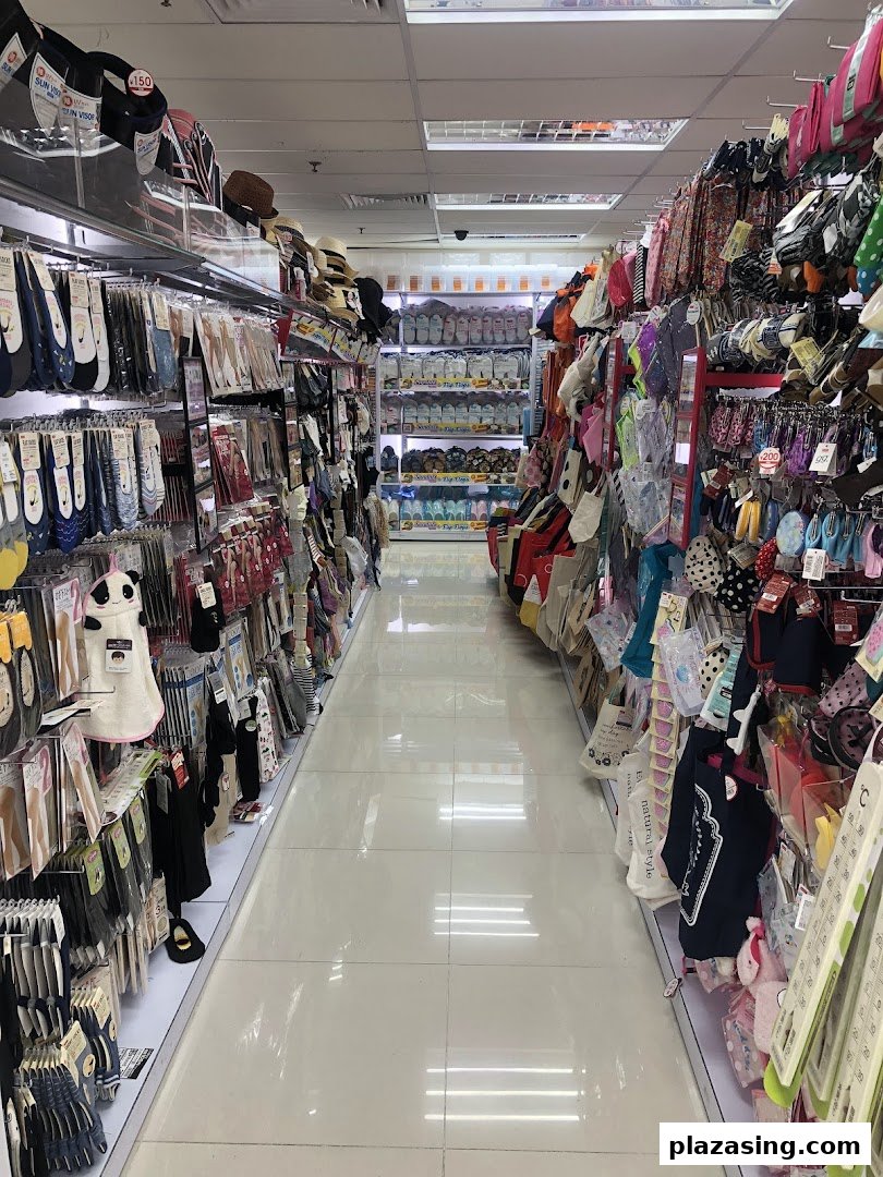 An interior view of a DAISO store aisle, showcasing a wide array of everyday goods and accessories.
