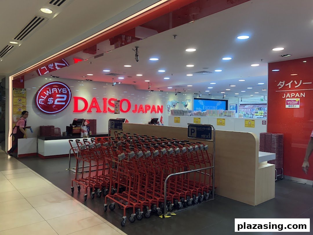 The brightly lit entrance of Daiso Japan, featuring its red logo, 'Always $2' sign, and a row of shopping carts.