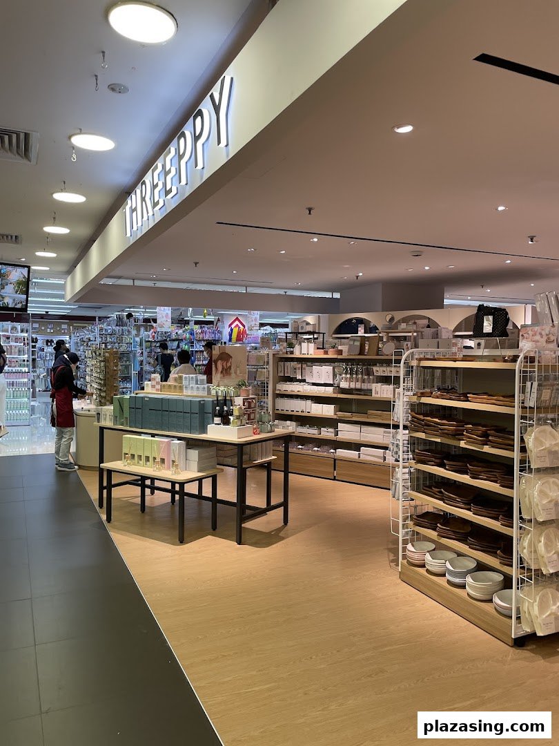 An interior view of DAISO THREEPPY, showcasing homeware, lifestyle products, and organized displays.