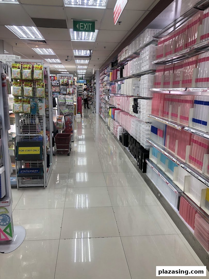 A brightly lit interior aisle of Daiso, featuring shelves stocked with diverse products.