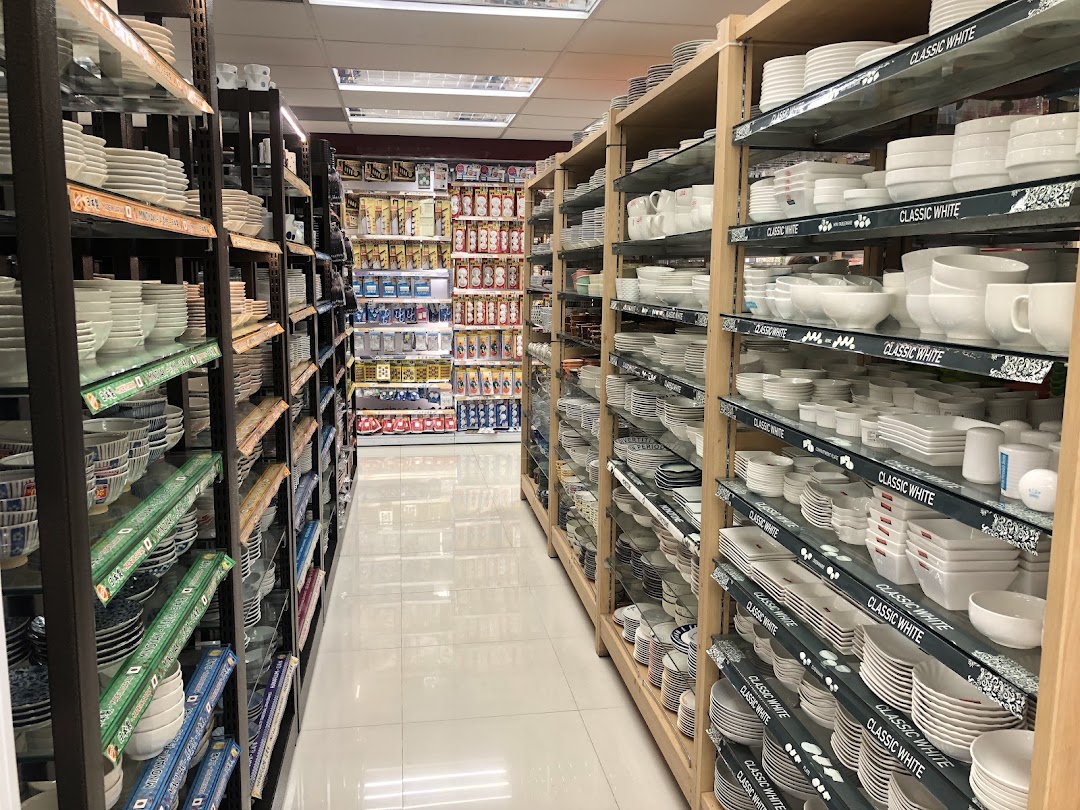 Interior view of Daiso Threeppy, showing aisles filled with diverse household goods and dinnerware.