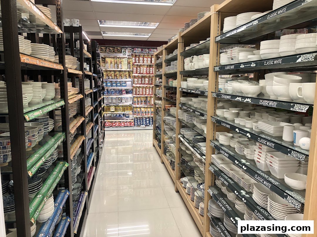 Interior view of Daiso Threeppy, showing aisles filled with diverse household goods and dinnerware.