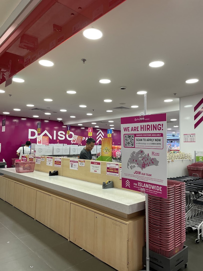 Interior view of Daiso's self-packing area, showcasing convenience and a hiring advertisement.