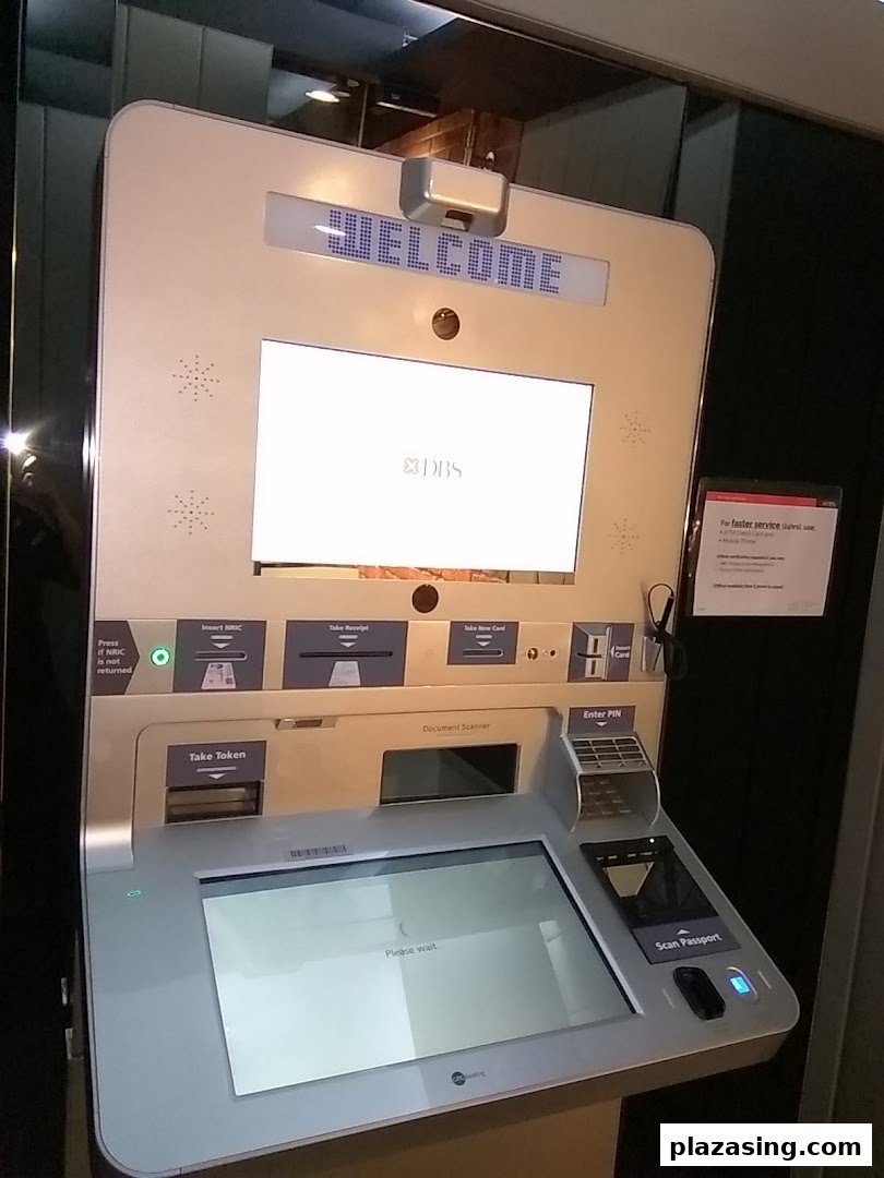A DBS self-service kiosk displaying 'WELCOME' and offering various banking functions.