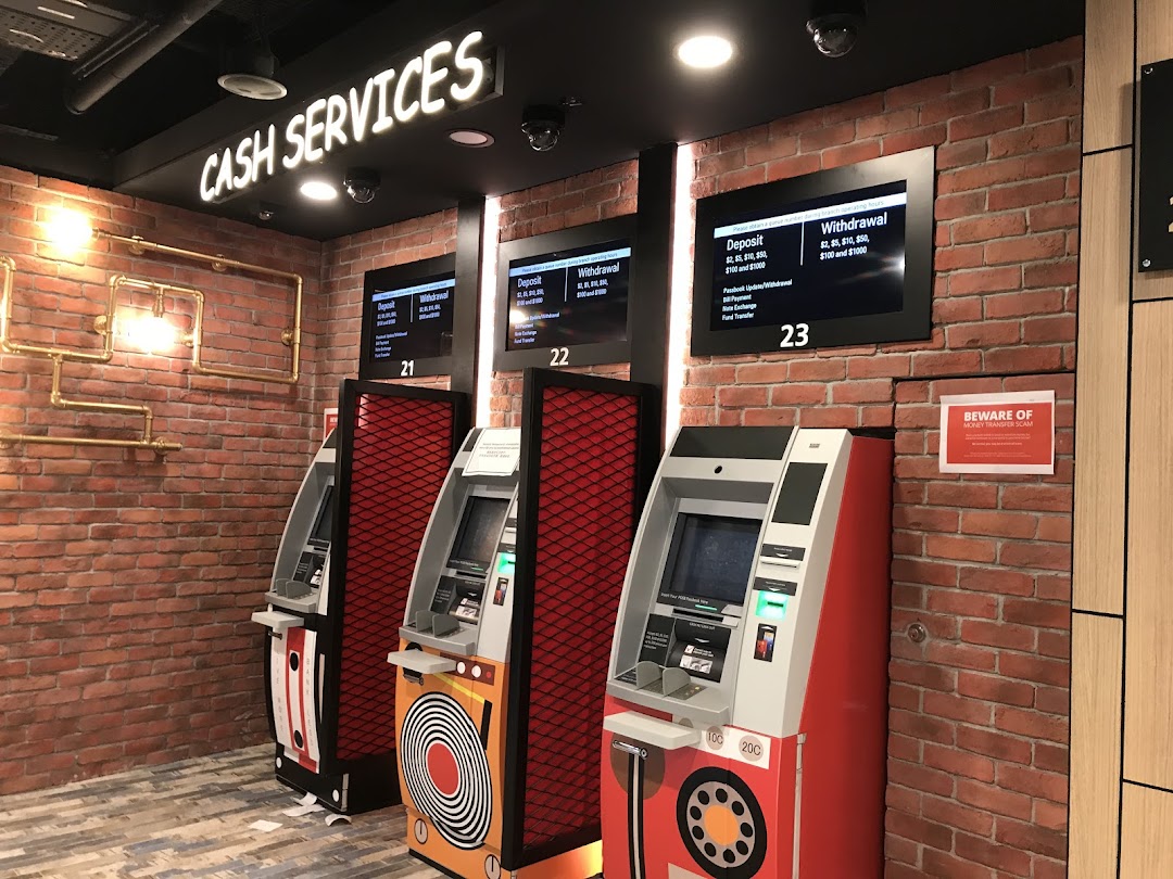 Interior view of DBS Plaza Singapura's cash services area with multiple ATMs.