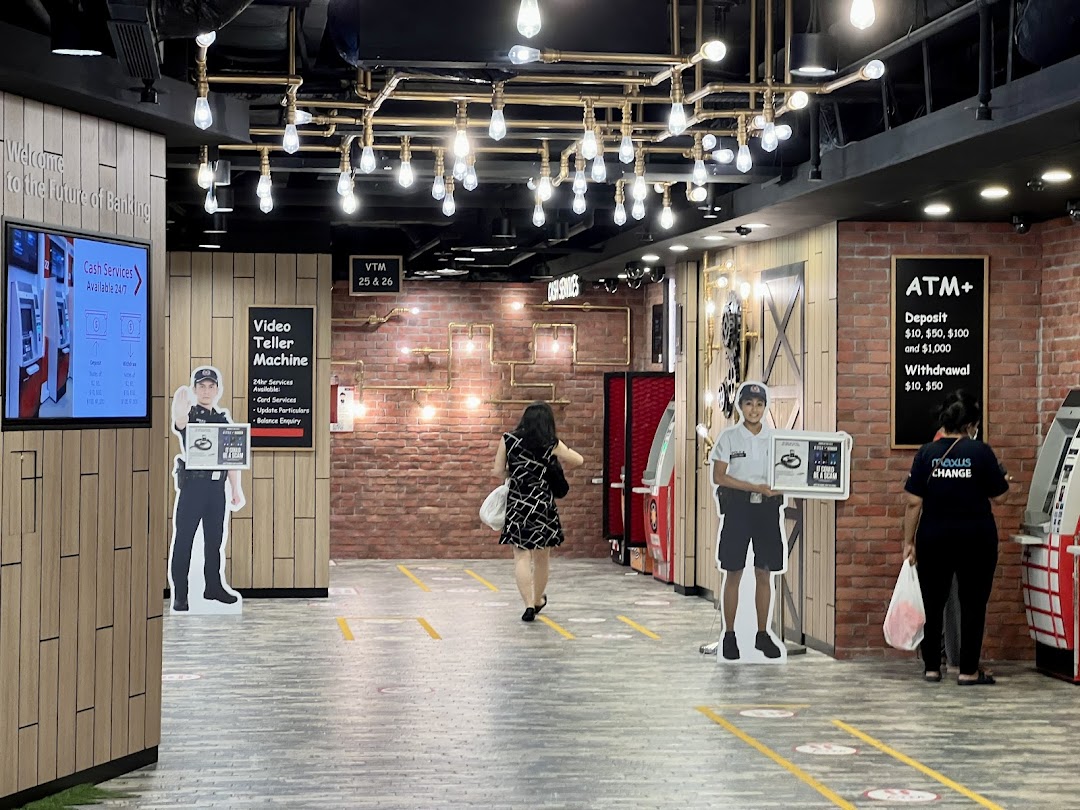 Interior of DBS Plaza Singapura branch with ATMs, Video Teller Machines, and modern banking services.