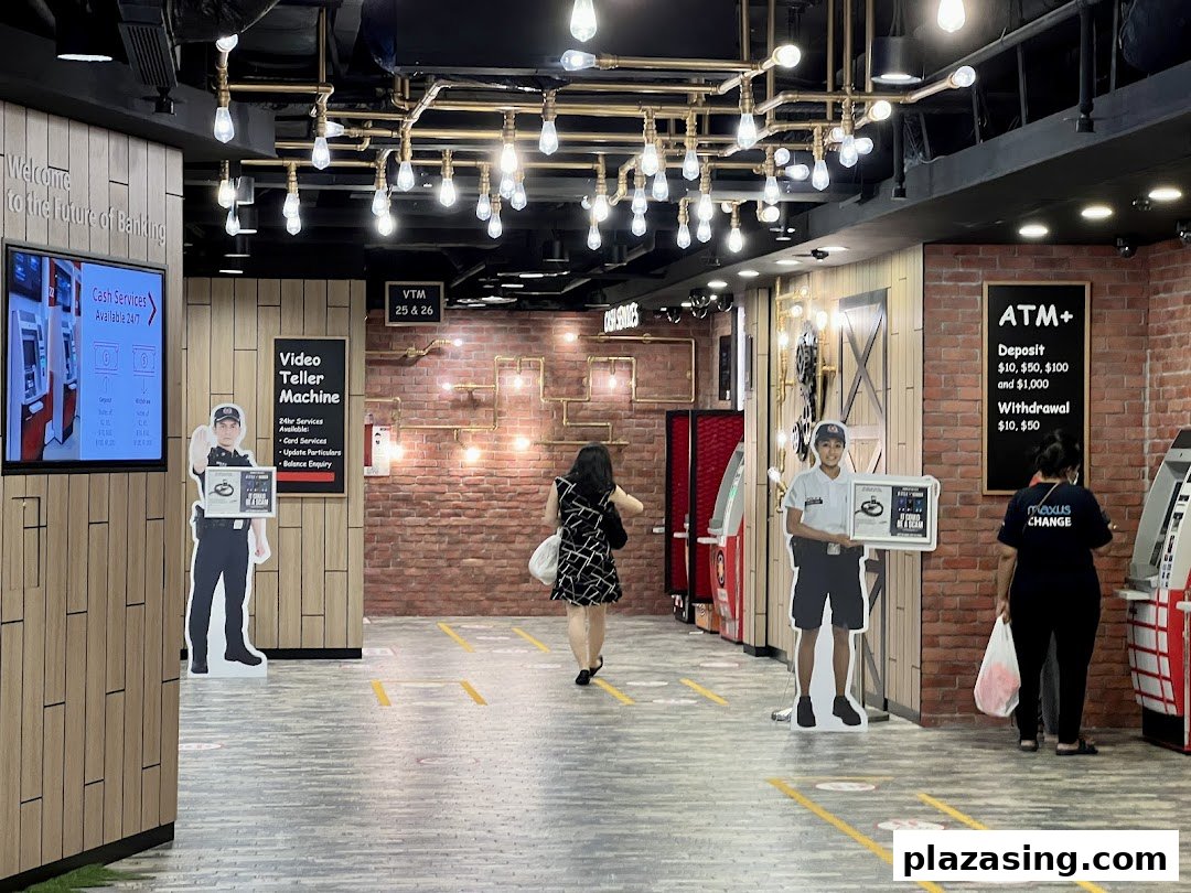 Interior of DBS Plaza Singapura branch with ATMs, Video Teller Machines, and modern banking services.