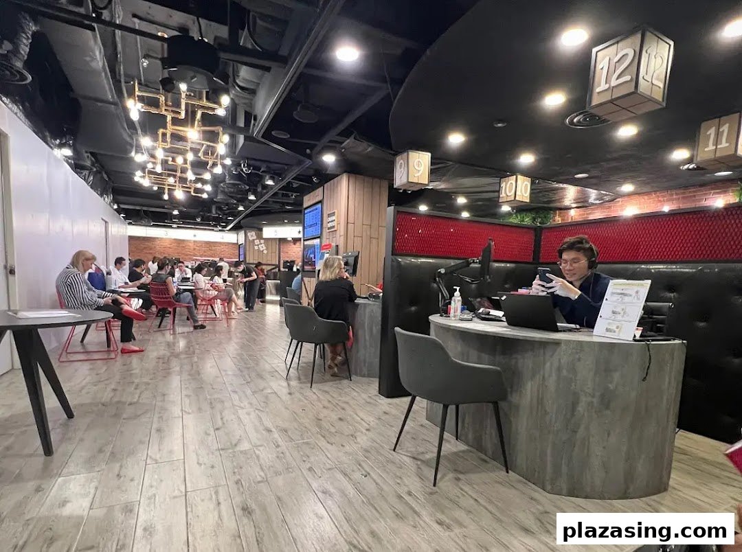 Interior view of a modern bank branch with customers seated in a waiting area and staff at service counters.