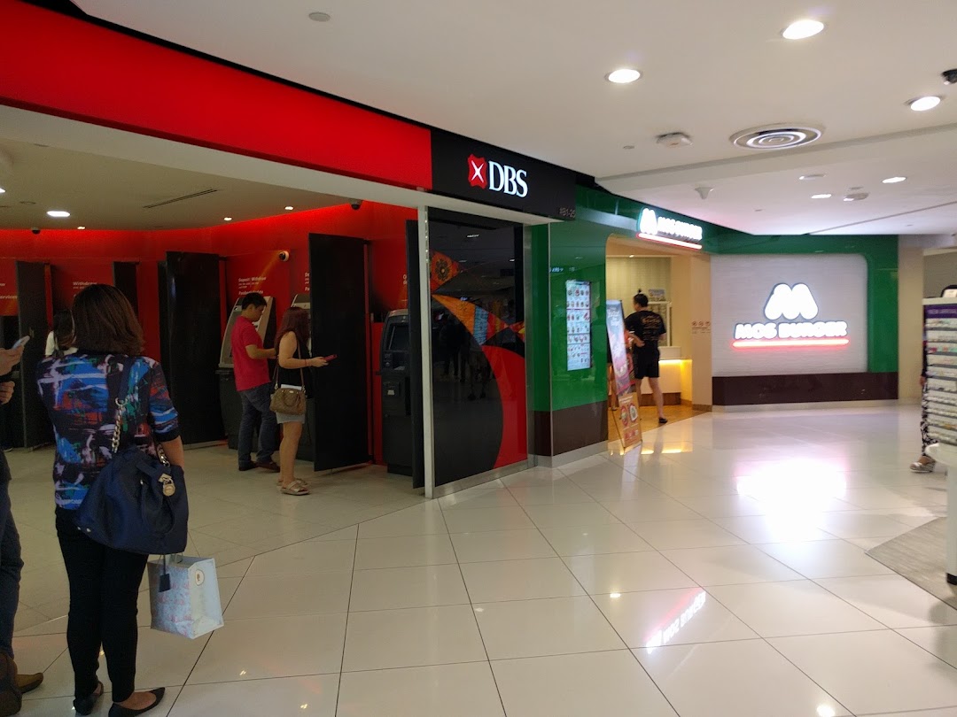 View of DBS Bank and Mos Burger entrances at Plaza Singapura, with customers using ATMs.