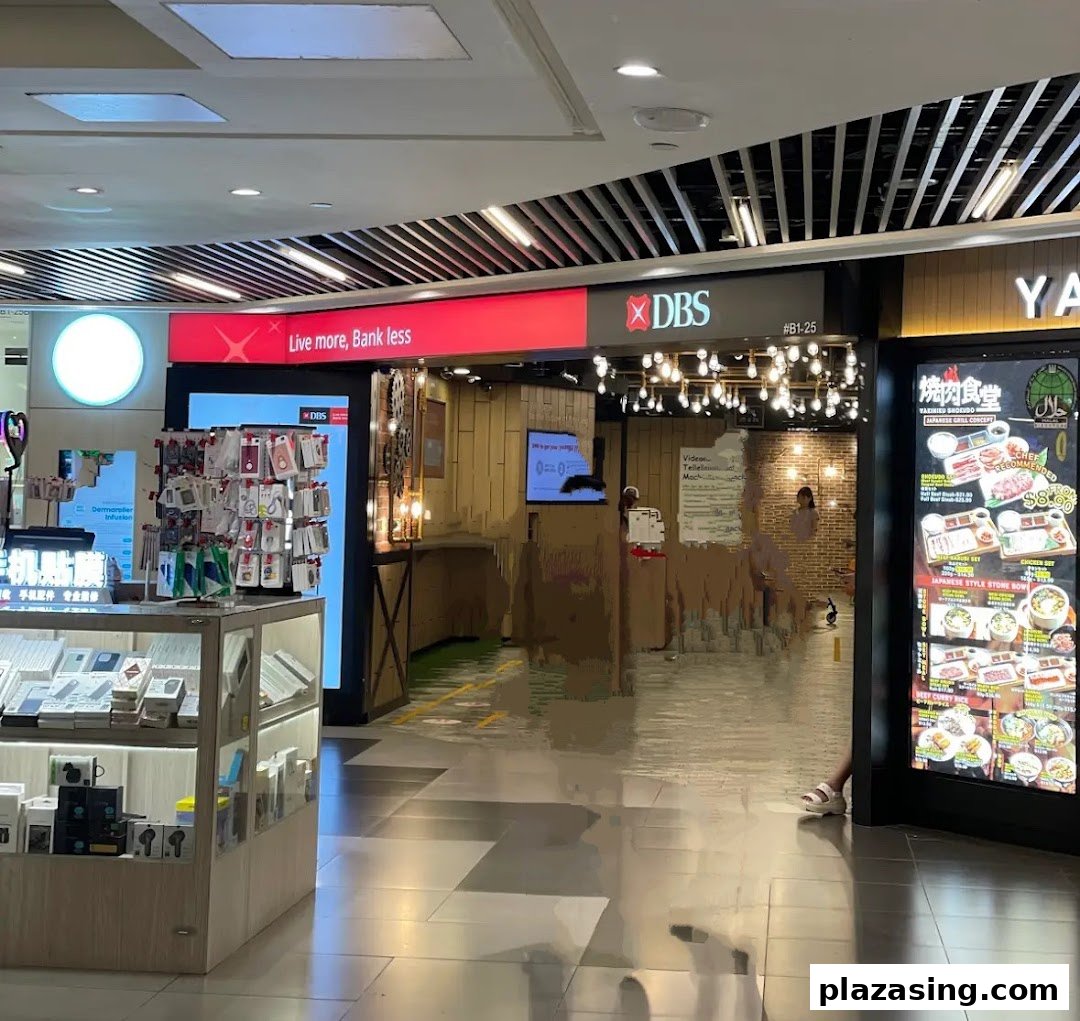 The entrance of the DBS bank branch at Plaza Singapura, featuring its prominent red signage.