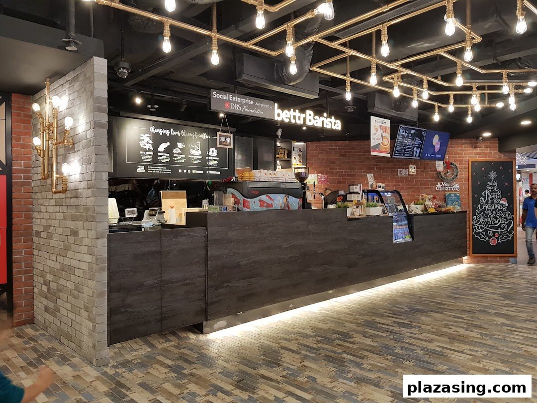 An inviting interior view of Bettr Barista coffee shop, featuring a counter, coffee machine, and festive decor.