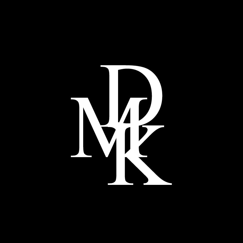 The DMK brand logo featuring stylized white letters 'D', 'M', and 'K' on a black background.