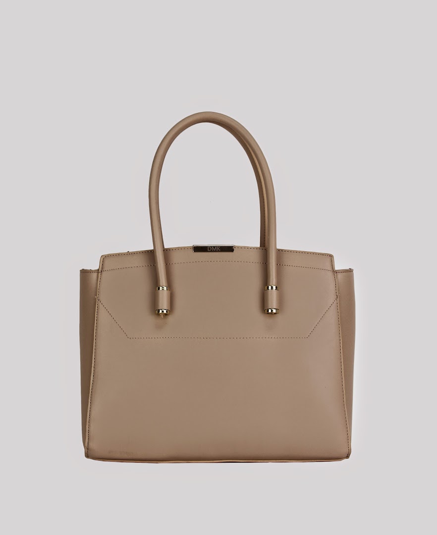 A stylish beige handbag with gold accents, showcasing DMK's accessory collection.