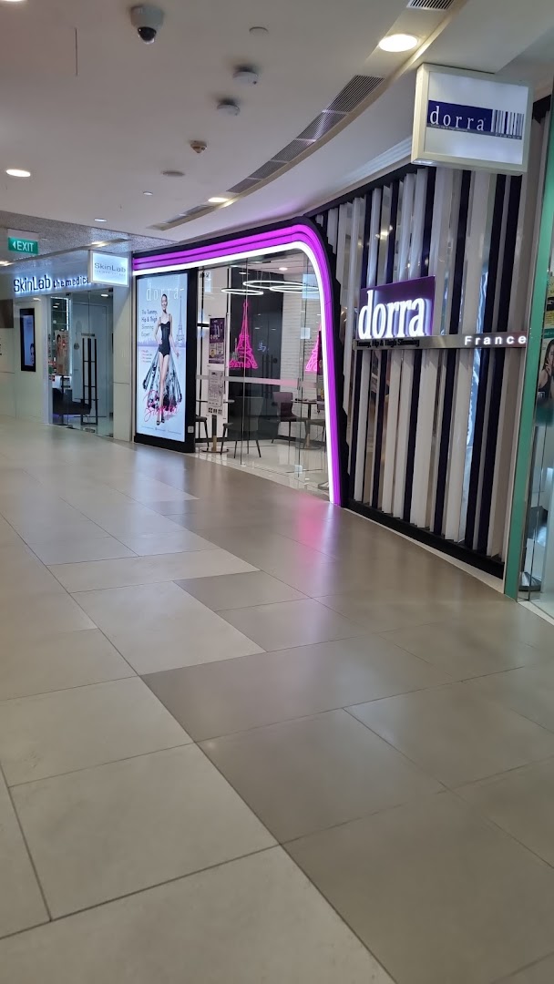 The shopfront of Dorra Slimming, a beauty and slimming center, located in a mall corridor.