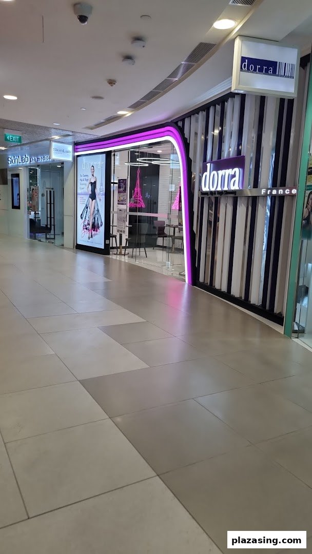 The shopfront of Dorra Slimming, a beauty and slimming center, located in a mall corridor.
