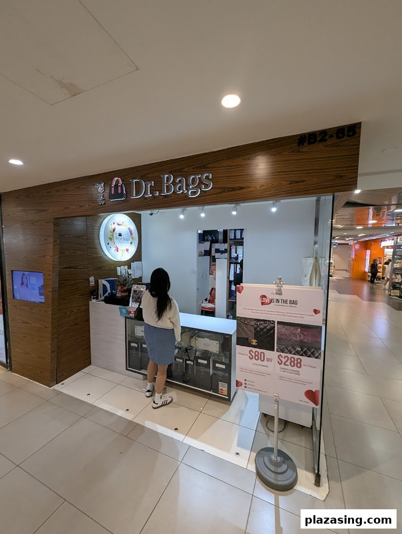 A customer stands at the counter of Dr.Bags, a shop specializing in bag care and restoration.