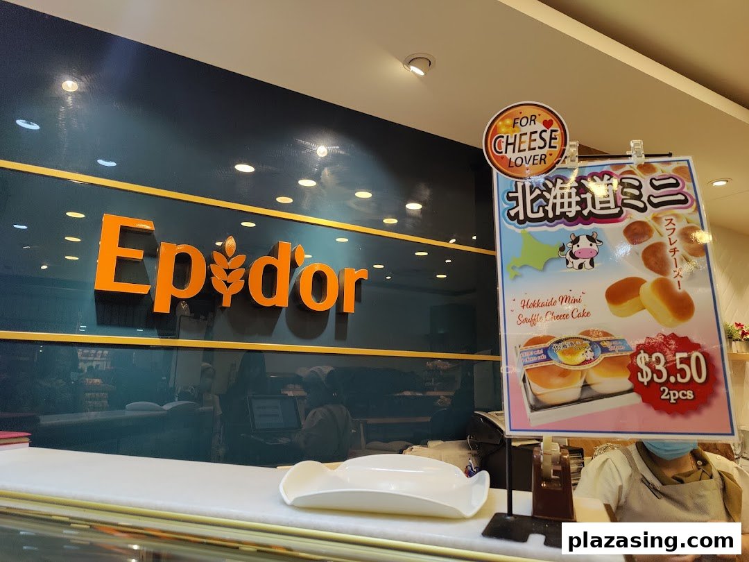 Interior view of Epi Dor bakery, showcasing its logo and a display for Hokkaido Mini Souffle Cheese Cake.