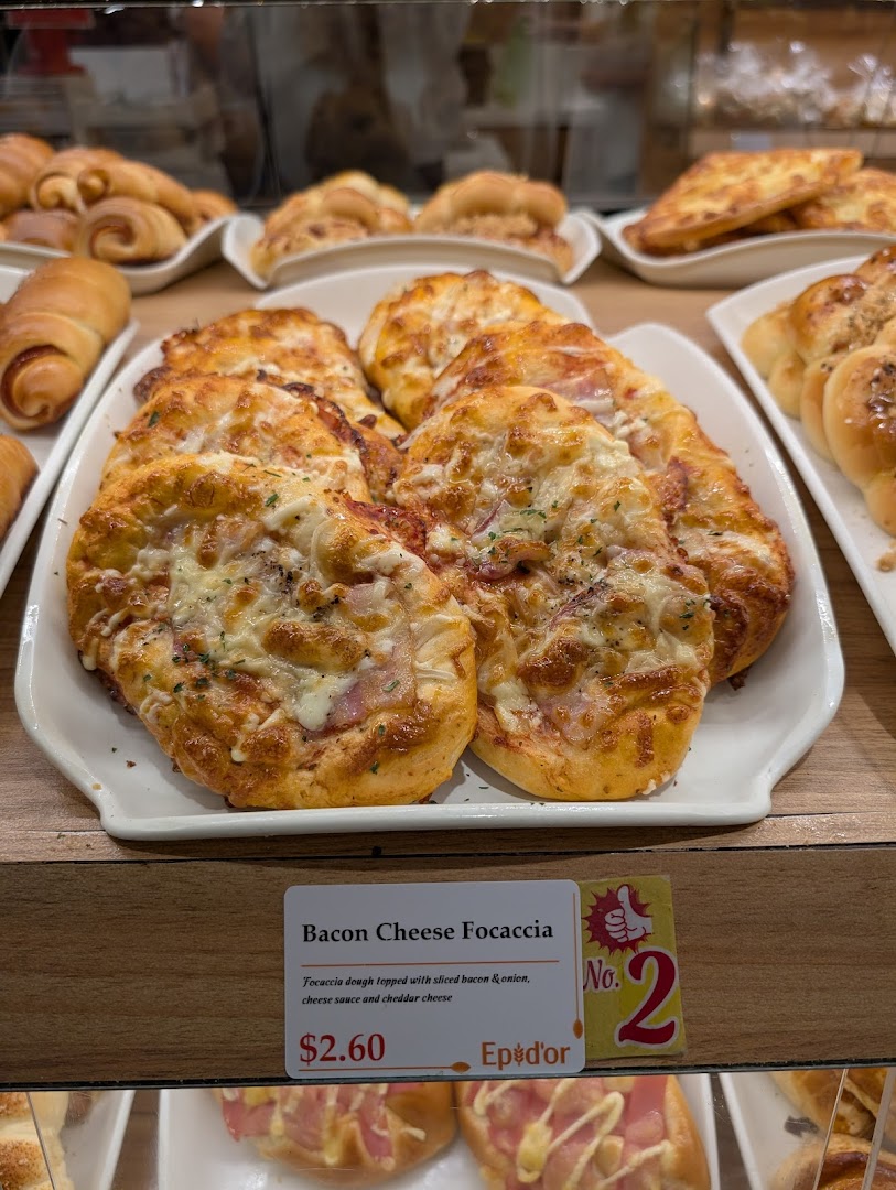 A display of freshly baked Bacon Cheese Focaccia and other pastries at Epi Dor.