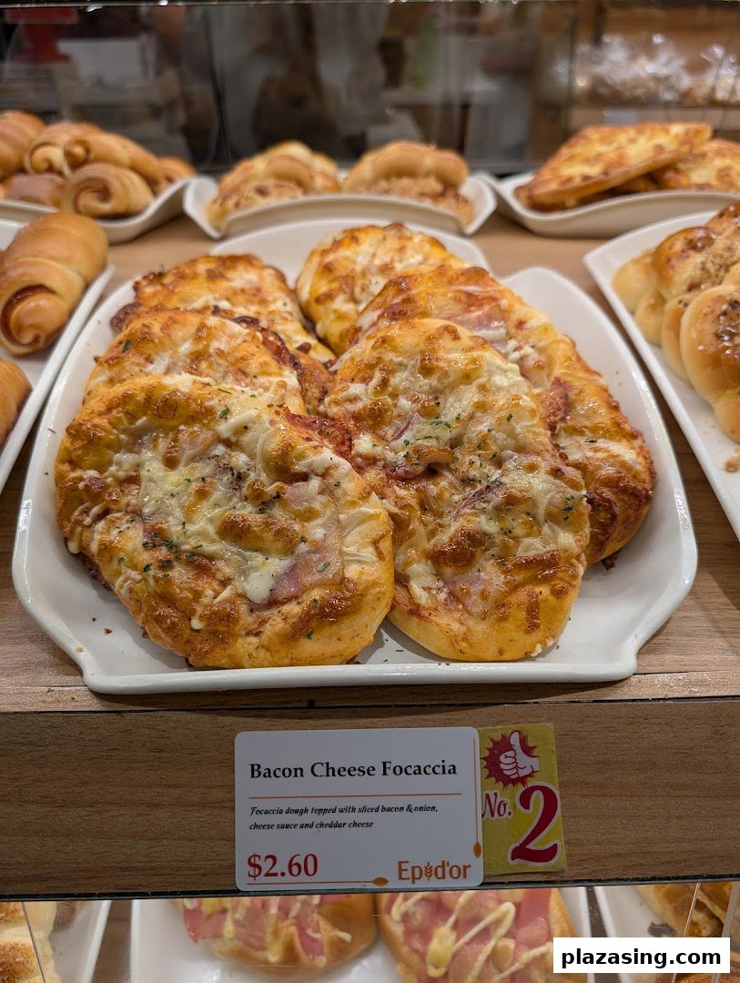A display of freshly baked Bacon Cheese Focaccia and other pastries at Epi Dor.