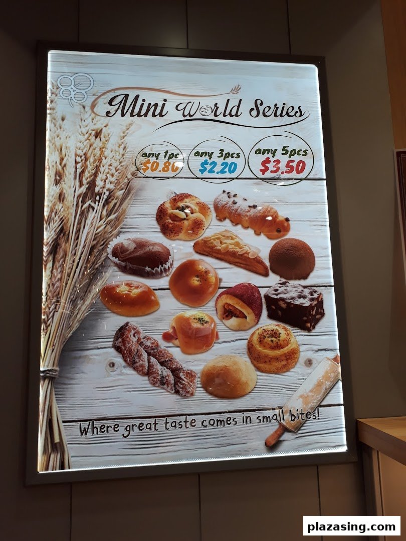 A bright display board showcasing Epi Dor's 'Mini World Series' pastries with pricing.