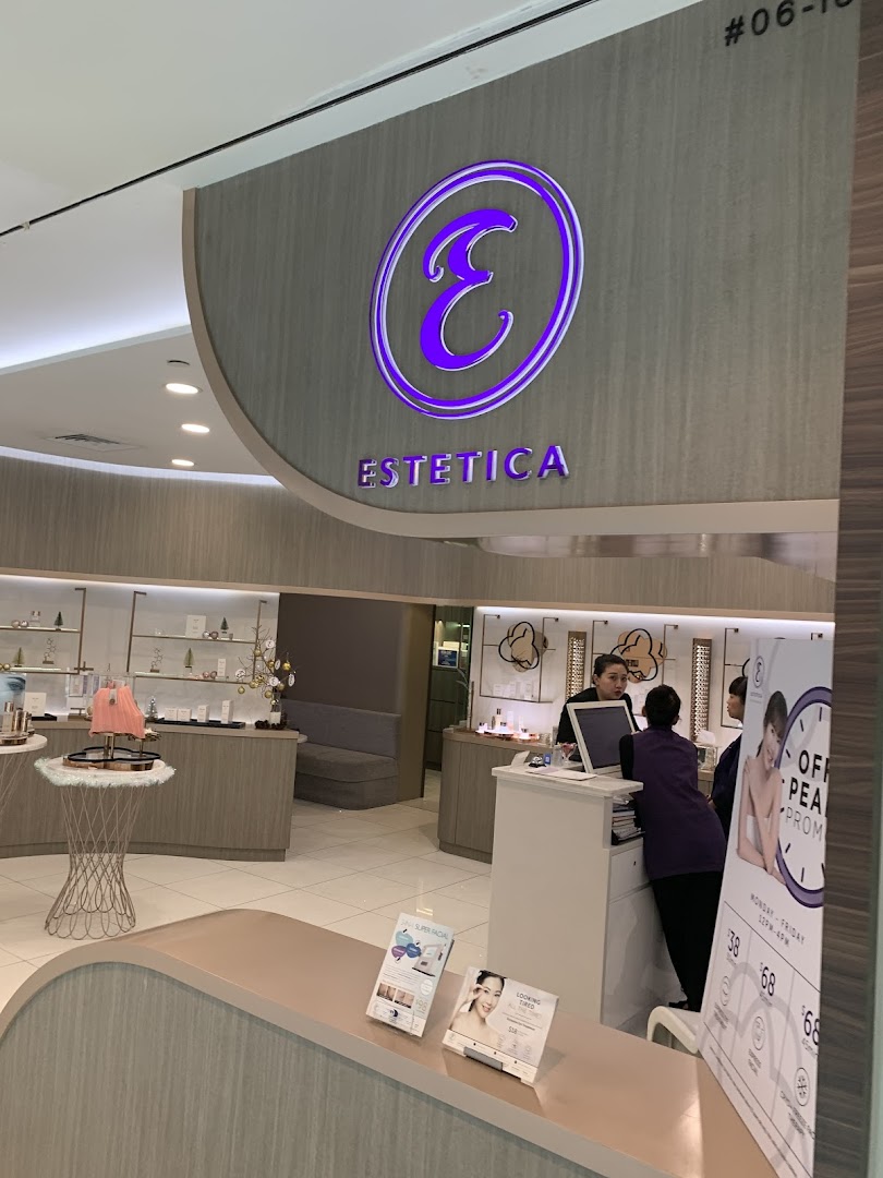 The inviting entrance and reception area of Estetica Beauty, showcasing its branding and a glimpse of the interior.