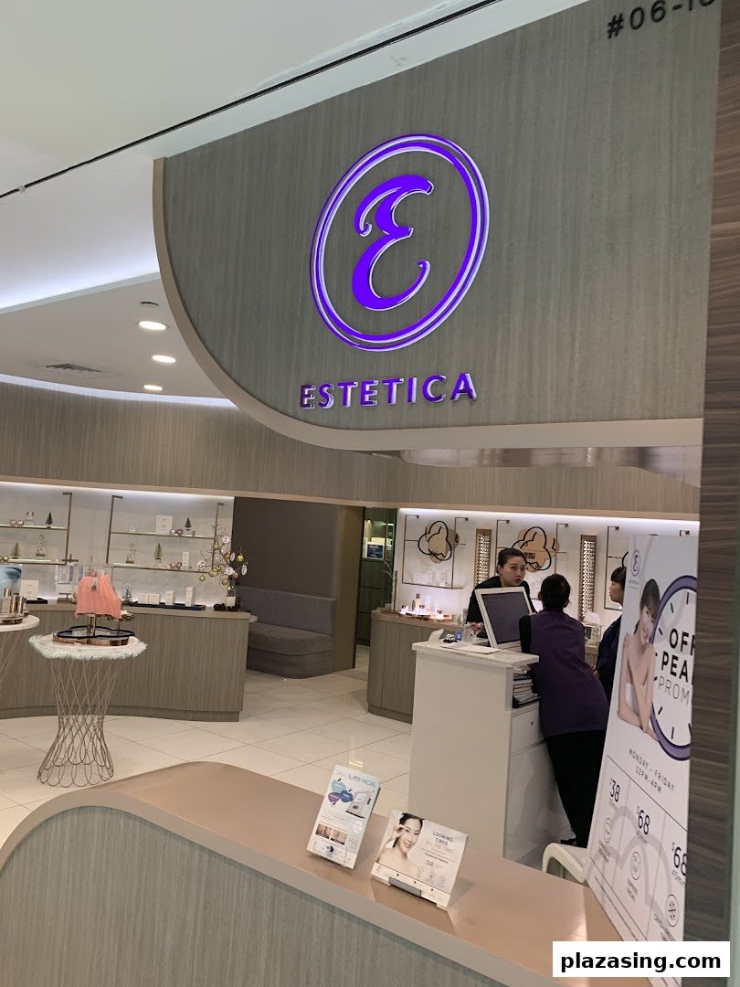 The inviting entrance and reception area of Estetica Beauty, showcasing its branding and a glimpse of the interior.