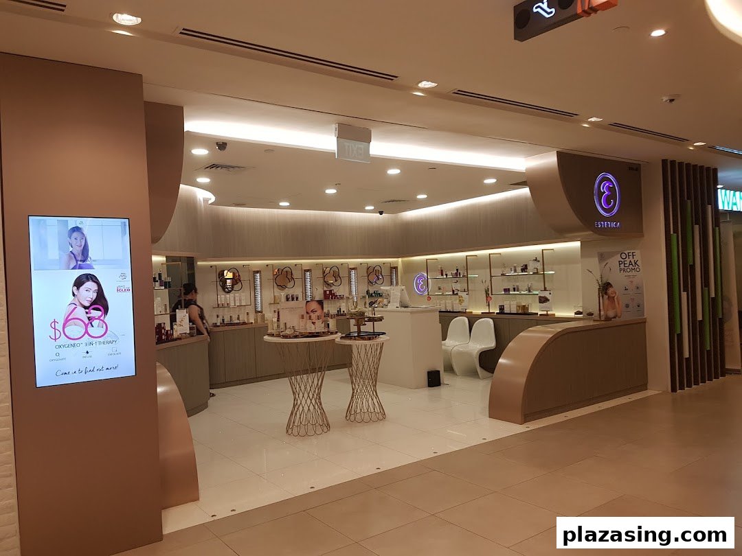 The inviting entrance of Estetica Beauty, a skincare and beauty salon, featuring a digital display.