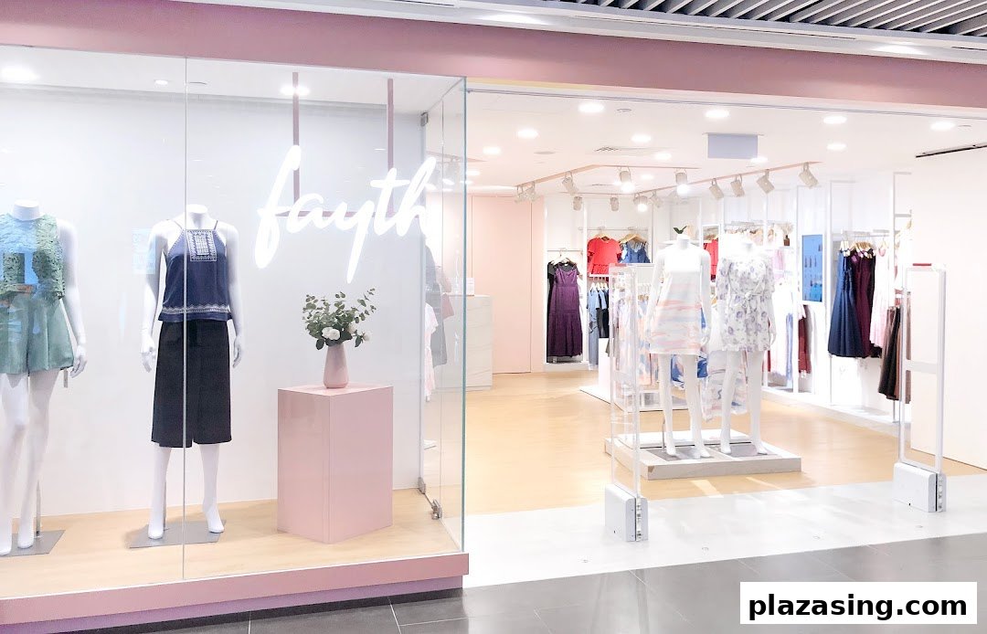 The shop front of Fayth, featuring mannequins displaying stylish apparel and a glimpse into the bright interior.