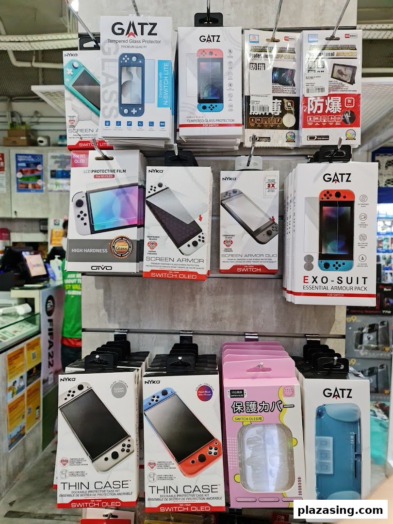 A display of Nintendo Switch and Switch OLED/Lite accessories, including screen protectors and cases, from brands like GATZ and NYKO.