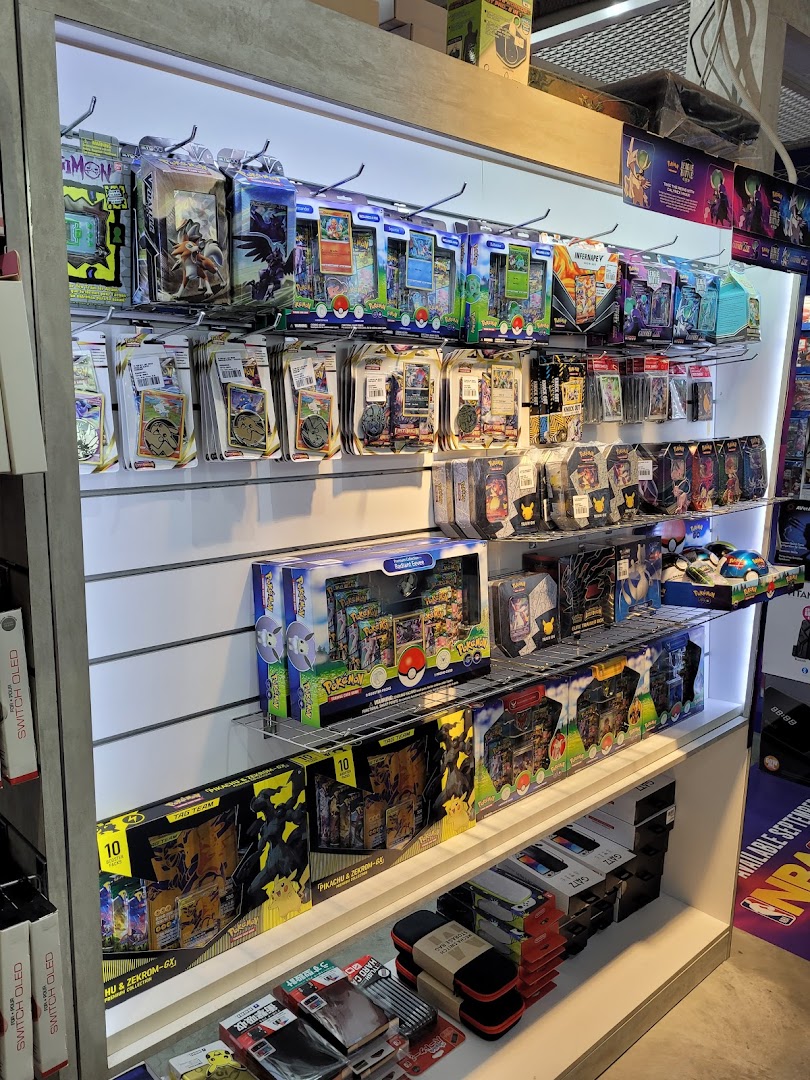 Shelves filled with a wide array of Pokémon trading card game products and gaming accessories.