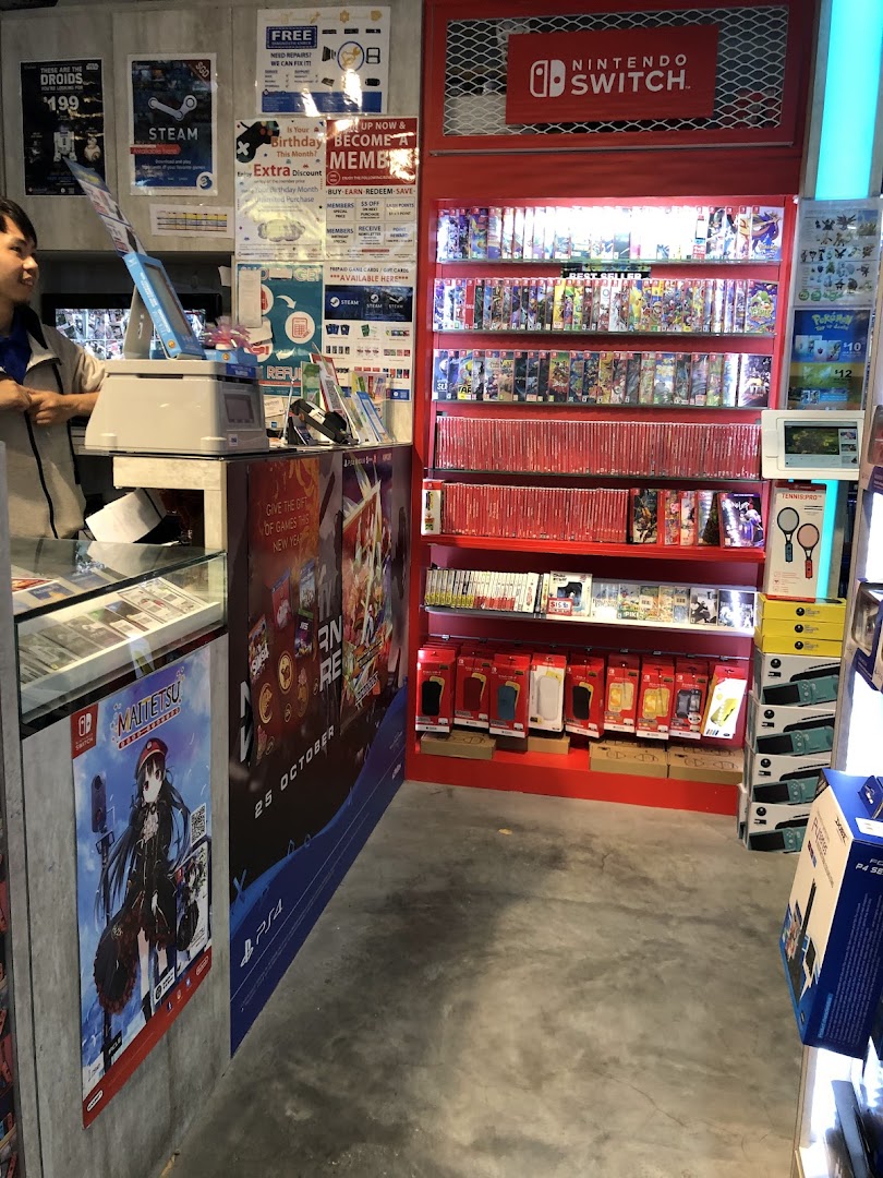 Interior view of GameMartz, featuring a prominent Nintendo Switch display and a staff member.