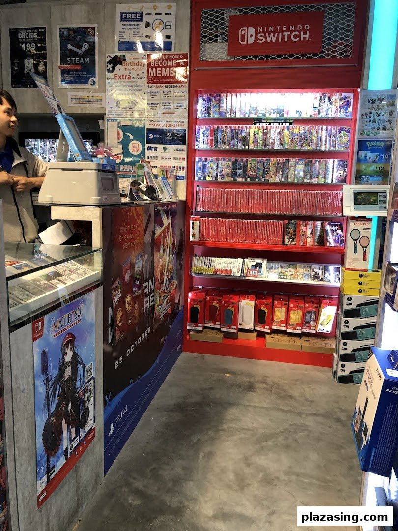 Interior view of GameMartz, featuring a prominent Nintendo Switch display and a staff member.