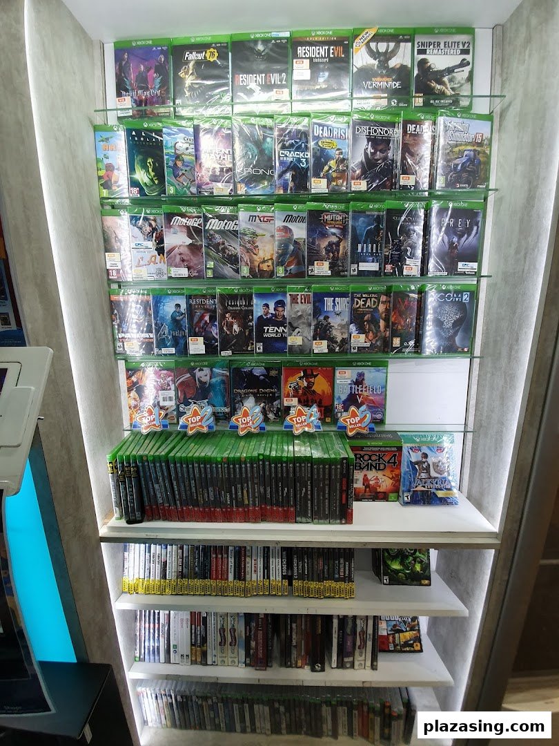 A tall display shelf at GameMartz showcasing a wide selection of Xbox One video games.