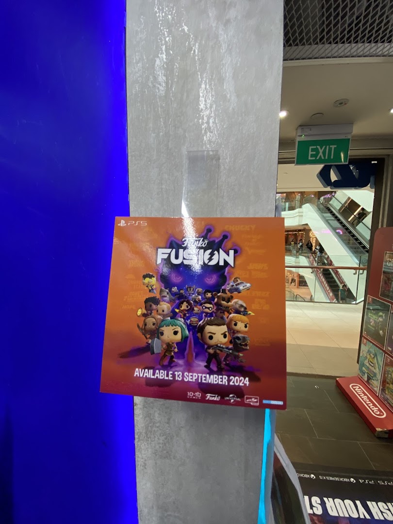 A promotional poster for the Funko Fusion game displayed on a pillar inside a shopping mall.